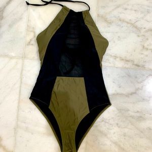 One piece bathing suit with mesh front. Padded